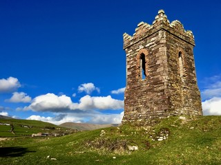 Old stony lighthouse by the sea