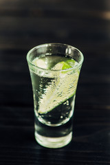 close up view of fresh tequila with lime