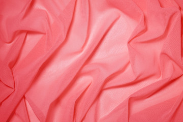 Draped with waves lightweight semitransparent fabric coral color