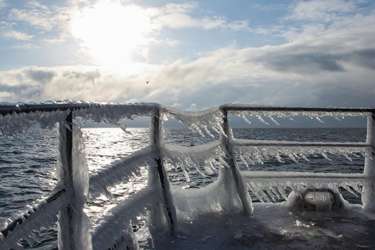 Icicles hanging on frozen ship's rail, Baltic Sea, Mecklenburg-Western Pomerania, Germany