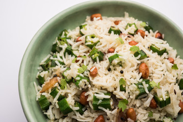 Okra or Bhindi rice also known as Vendakkai Sadam, served in a bowl, selective focus
