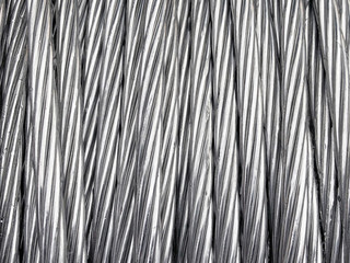 Close up of coiled metal cable industrial background