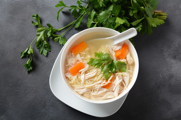 Chicken soup with noodles and vegetables in bowl. Healthy food concept