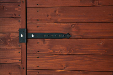fragment of a wooden door with metal fastening