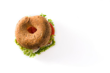 Vegetable bagel sandwich with tomato, lettuce, and mozzarella cheese isolated on white background. Top view. Copy space	