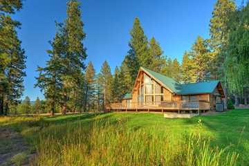 Luxury Cedar cabin home with Large pine tree and pond - obrazy, fototapety, plakaty