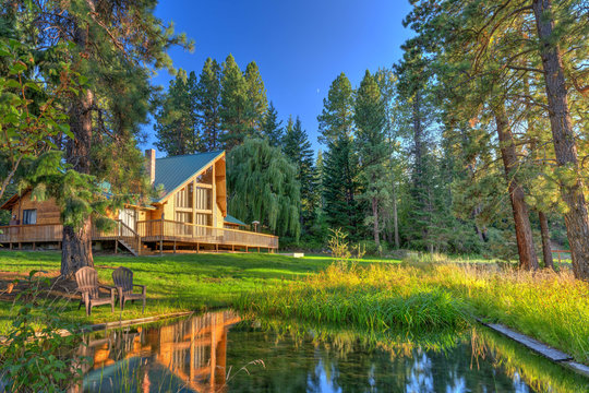 Luxury Cedar cabin home with Large porch, pine trees and pond