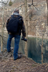  photographer scans the blue water of France park looking for his next shot. Located in Logansport Indiana