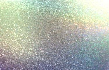 Holiday glitter background. Green yellow blue gradient. Brilliance shimmer pattern. Iridescent sparkles abstract blurred texture. Diamond glitz.
