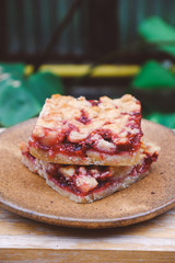Homemade raspberry crumble bar on plate