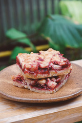 Homemade raspberry crumble bar on plate