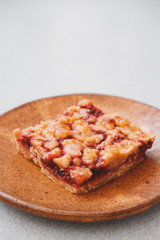 Homemade raspberry crumble bar on plate