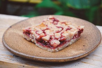 Homemade raspberry crumble bar on plate