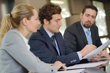 Business people negotiating commercial contract