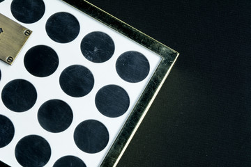 Make-up colorful eyeshadow palettes isolated on black background. View from above. 