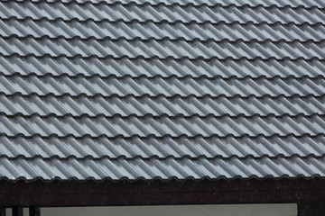 rain storm downpour on black roof tile of residential house