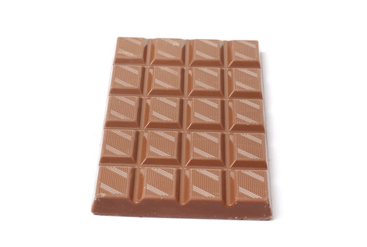 A bar of milk chocolate isolated on a white background. top view