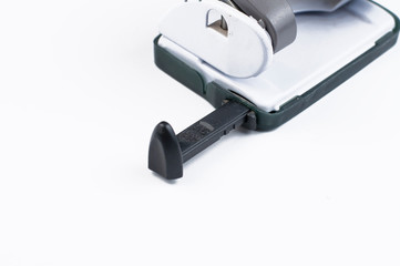 Paper punching tool isolated on white background.Copy space