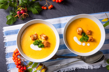 Delicious pumpkin soup with croutons and coconut milk