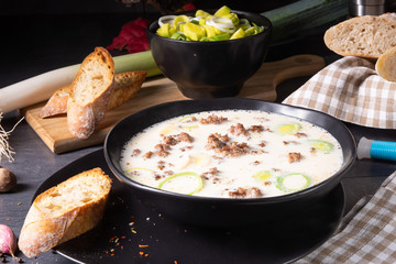 Delicious cheese and leek soup with minced meat
