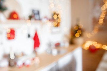 Naklejka na ściany i meble Beautiful holiday decorated room with Christmas tree and bright lights , out of focus shot for photo background. Blur christmas background