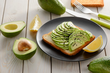 Avocado toast with sesame seeds and lemon