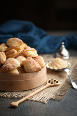 Homemade cookies with cottage cheese in a rustic bowl on a dark background.