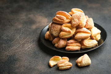 A plate with homemade cookies with cottage cheese on a dark background.
