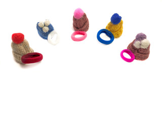 Elastic bands for hair isolated on a white background. Elastic bands for hair in the form of a winter hat. Set of hairpins. 