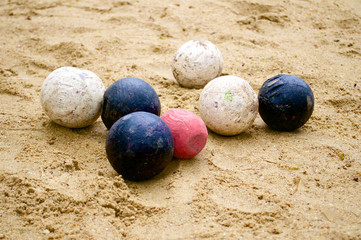 old balls for playing petanque on yellow sand