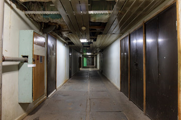 Long dark corridor in an old industrial building