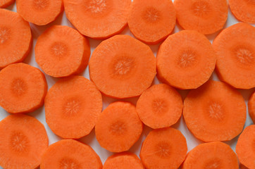 Carrots pattern - chopped raw carrots, round orange pieces make a pattern - sweet and healthy food