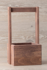 Basket with wooden handle