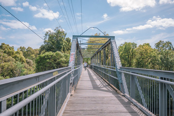 Main Yarra trail on steel bridge over the Yarra River in Victoria, Australia.