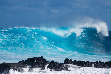The waves of the ocean beat violently along the coasts of Easter Island, Chile