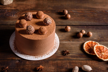 Christmas holiday table with delicious truffle cake and beautiful gingerbreads