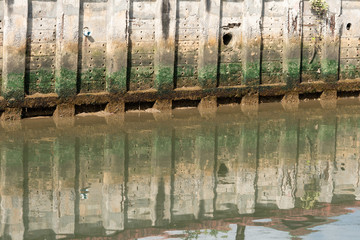 Dirty water flows from city, waste water flows polluting water