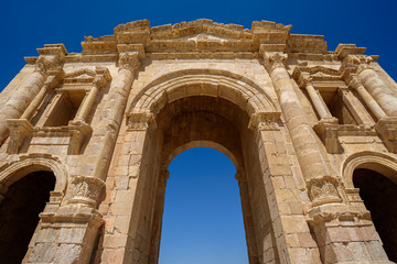 Fototapeta na wymiar 2nd century Arch of Hadrian at ruins of Ancient Roman City Gerasa In Jerash, Jordan