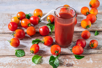 Fresh Tomato Juice with Tomato on Wooden Floor