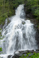 high waterfall in the forest from the mountain long exposure
