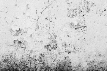 Texture of a concrete wall with cracks and scratches which can be used as a background
