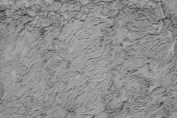 Texture of a concrete wall with cracks and scratches which can be used as a background