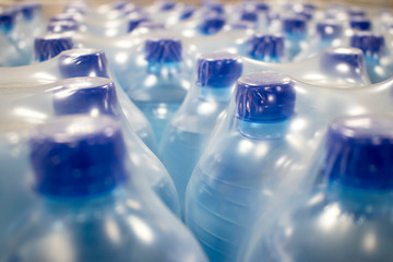 Water in plastic bottles.