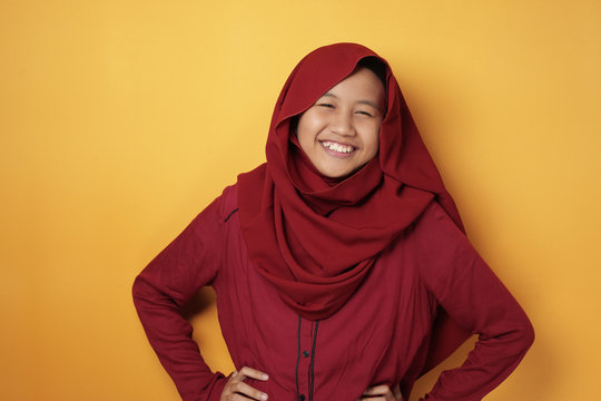Asian Muslim Teenage Girl Wearing Hijab Smiling at Camera