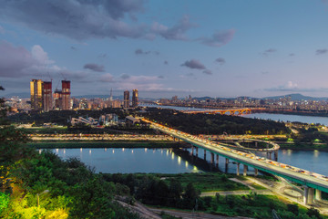 Fototapeta premium Night view of city. Sky scrapers, building, factory, Han river and park.