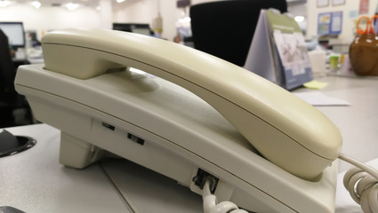 close up soft focus on telephone devices at office desk .