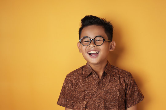 Asian Boy Looking At Camera And Laugh