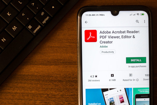 Ivanovsk, Russia - June 26, 2019: Adobe Acrobat Reader app on the display of smartphone.