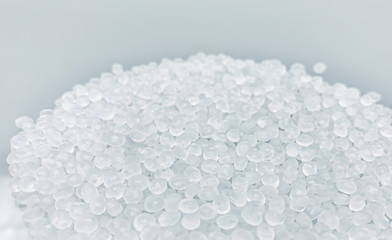 Polypropylene granule close-up background texture.