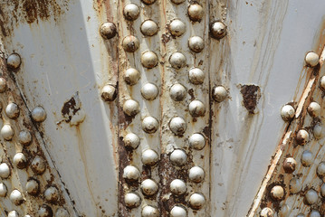 Close-up of an old, riveted, industrial, storage tank